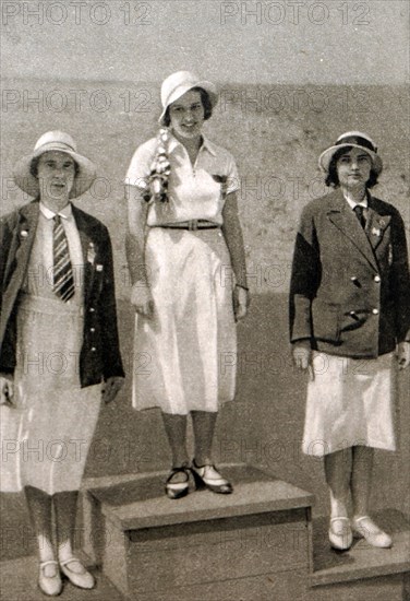 Photograph of the podium for the women's foil at the 1932 Olympic games. Ellen Müller-Preis (1912 - 2007) took gold for Austria, Heather Seymour "Judy" Guinness (1910 - 1952) silver for Great Britain & bronze Erna Bogen-Bogáti (1906 - 2002) of Hungary.