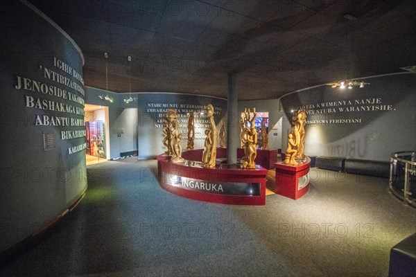 A carved wooden statue inside of the Kigali Genocide Memorial, Kigali, Rwanda.