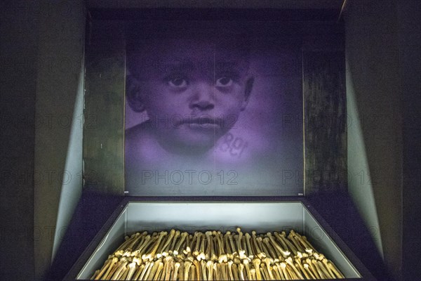 The remains of known victims of the 1994 Rwandan Genocide remain interred and on display inside of of the Kigali Genocide Memorial as a testament to t