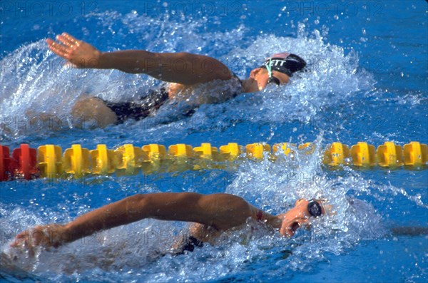 Barcelona, Spain, 1992: Team USA swimmer Nicole Haislett, top, competing in freestyle event at the 1992 Summer Olympics. ©Bob Daemmrich