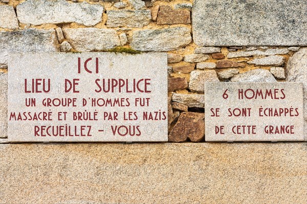 Europe, France, Haute-Vienne, Oradour-sur-Glane. Sept. 5, 2019. Signs saying 'Place of Torture, a group of men was massacred and burnt by the Nazis' a