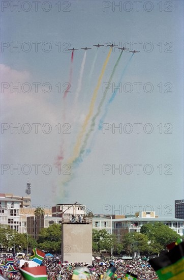 A display with coloured smoke by the Silver Falcons, aerobatic team of the South African Air Force, at Nelson Mandela's inauguration in Pretoria, 1994.