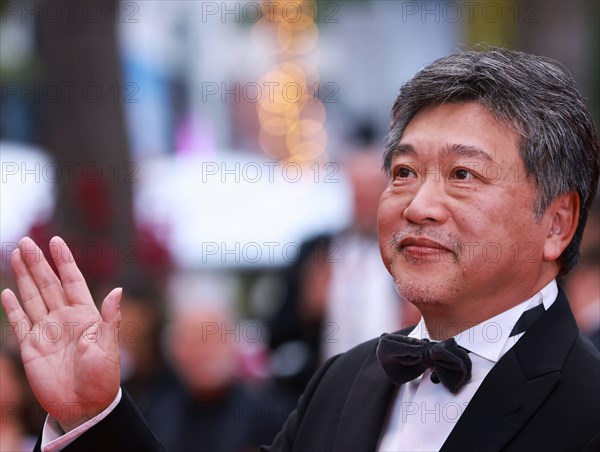 230518 -- CANNES, May 18, 2023 -- Japanese director Kore-Eda Hirokazu poses as he arrives for the screening of the film Kaibutsu Monster which will compete for the Palme d Or during the 76th edition of the Cannes Film Festival in Cannes, southern France, May 17, 2023.  FRANCE-CANNES-FILM FESTIVAL-KAIBUTSU GaoxJing PUBLICATIONxNOTxINxCHN
