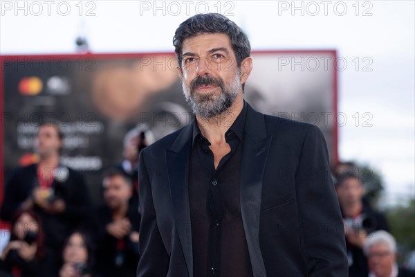 VENICE, ITALY - AUGUST 30: Actor Pierfrancesco Favino attends the red carpet for the movie "Comandante" at the 80th Venice International Film Festival