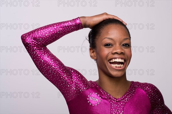 USA gymnast Gabby Douglas poses at the USOC Media Summit in Dallas, TX prior to the 2012 London Olympics
