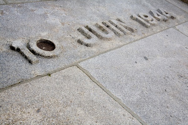 Carved date in stone floor at the French village Oradour-sur-Glane. It reads 10 June 1944