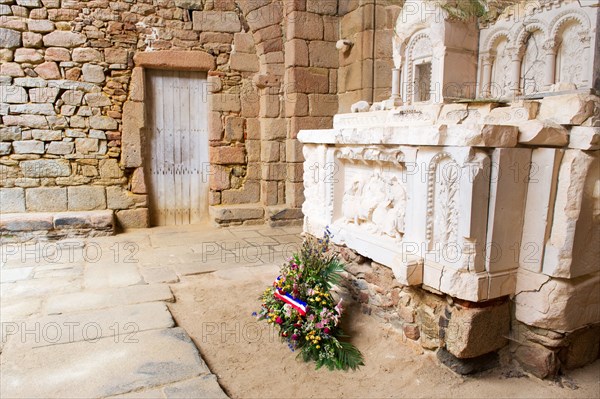 Destroyed church with flowers in Oradour sur Glane in the French Limousin