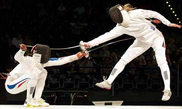 The German epee fencer Britta Heidemann (R) fights against against Laura Flessel-Colovic from France during the European Fencing Championship in Leipzig, Germany, 21 July 2010. France won the team competition against the German team at 45-35 hits and came in third place. Photo: Peter Endig