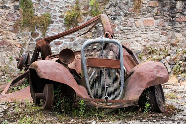Rusting car at Oradour-sur-Glane. The village was destroyed on 10 June 1944 by German soldiers.
