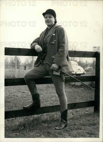 Mar. 03, 1956 - Olympic games Equestrian team in training. Pat Smythe in Texas style boots.: Members of the Olympic games Equestrian Team were to be seen in training this morning at Windsor Forest stud, Ascot. Photo shows Pat Smythe wears Texan style boots prior to going for a training round at Windsor Forest Stud this morning.