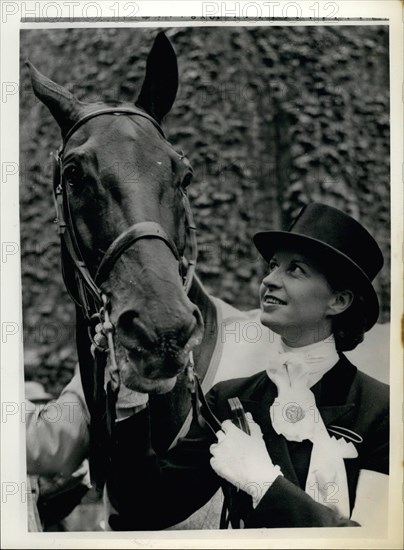 Jun. 06, 1956 - Equestrian Olympic games in Stockholm. Danish rider wins silver medal in Dressage. Photo shows Lis Hartel (Denmark) with her silver medal and her mount ''Jubilee'' after they had won second place in the Grand Prix de Dressage event of the Equestrian Olympic Games in Stockholm.