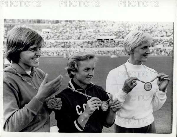 Sep. 01, 1960 - Olympic Games In Rome. Men's 100 Metres Heats Event. Photo shows V. Krepkina, of Russia, pictured in centre with her Gold Medal, after winning the Women's Olympic Long Jump in Rome yesterday. On left is H. Claus (Germany), with her bronze medal and on right is E. Krzesinska, of Poland, with her silver medal.