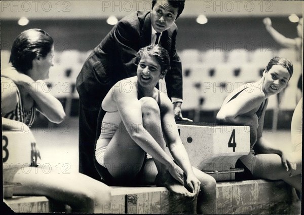 1964 - Tokyo Olympics: Dawn Fraser, chats with one of her team mates at the Olympic Pool. The Australian swimmer looks confident of winning a gold medal. © Keystone Pictures USA/ZUMAPRESS.com/Alamy Live News
