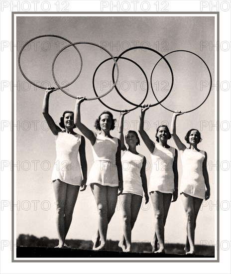 1936 Olympic Games, Berlin, Germany The Olympic Rings held aloft by five young sportswomen 1936 SUMMER OLYMPICS, BERLIN,  photo card showing blond aryan dancers with the Olympic rings, BERLIN Olympic Stadium  AUGUST 13th 1936 Germany