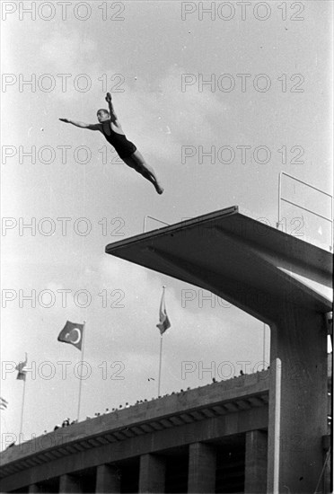 Summer Olympics 1936 - Germany, Third Reich - Olympic Games, Summer Olympics 1936 in Berlin. Men swimming competition at the swimming stadium  - platform  diver - view of the jump. Image date August 1936. Photo Erich Andres