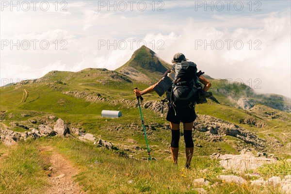 girl Hiker on countryside landscape in the Pyrenees, Pyrenees in France. High quality photo