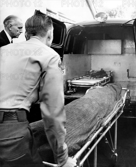 Cloaked corpse of starlet Marilyn Monroe after she was found dead