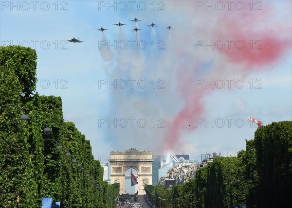 U.S. F-35 Fighter aircraft and the USAF Thunderbirds perform a flyby over the Arc de Triomphe during the annual Bastille Day military parade July 14, 2017 in Paris, France. U.S. President Donald Trump was the guest of honor of French President Emmanuel Macron for the event marking the 100th anniversary of the U.S. entry into World War I.