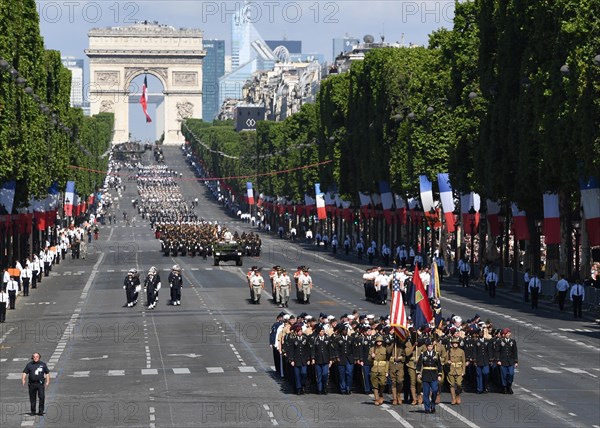 170714-N-AC979-372 PARIS (July 14, 2017) Almost 200 U.S. Soldiers, Sailors, Marines and Airmen assigned to units in Europe and the 1st Infantry Division, Fort Riley, Kansas, march down the Avenue des Champs-Élysées from the Arc de Triomphe to the Place de la Concorde during the Military Parade on Bastille Day. An historic first, the U.S. led the parade as the country of honor this year in commemoration of the centennial of U.S. entry into World War and the long-standing partnership between France and the U.S. (U.S. Navy photo by Chief Mass Communication Specialist Michael McNabb/Released)