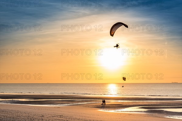 Paramotors in the sky of Wissant (France), at sunset.