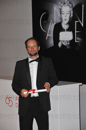 CANNES, FRANCE. May 27, 2012: Carlos Reygadas at the winners' photocall at the closing awards gala at the 65th Festival de Cannes. © 2012 Paul Smith / Featureflash