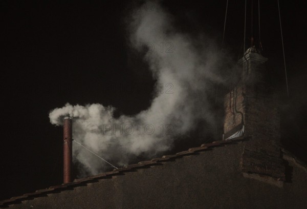 March 13, 2013 - Vatican City - White smoke is seen from the roof of the Sistine Chapel signaling that the cardinals elected a new pope. (Credit Image: © Evandro Inetti/ZUMAPRESS.com)