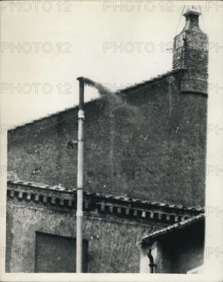 Jun. 20, 1963 - Black Smoke Shows No Pope Yet. This morning black smoke was seen to be coming from the chimney of the stove in the Sistine Chapel of the Vatican where the Cardinals are meeting in sealed Conclave to elect the new Pope. The black smoke is an indication to the outside World that they have had an inconclusive vote, and there is still no Pope. Photo Shows:- Black smoke coming from the chimney today.