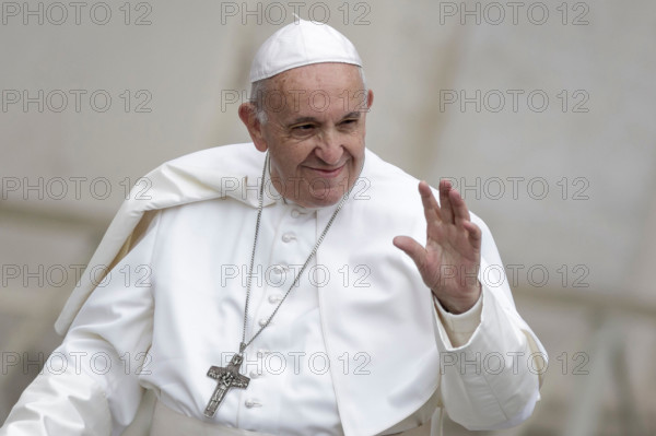 Pope Francis greets the faithful as he arrives to lead his Weekly General Audience in St. Peter's Square. (Photo by Giuseppe Ciccia / Pacific Press)