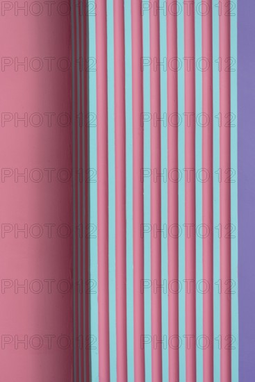 vertical pink green purple striped concrete or cement wall architecture abstract background
