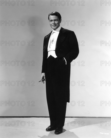 ORSON WELLES Portrait as a Magician in his Mercury Wonder Show in FOLLOW THE BOYS 1944 director A. EDWARD SUTHERLAND producer Charles K. Feldman gowns Vera West Universal Pictures