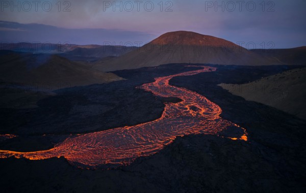 Flowing lava in volcanic mountains