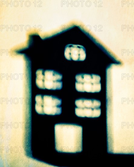 Shadow of a house on a wall