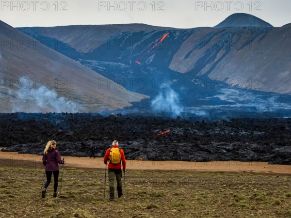 Local Icelanders visiting lava flows from Fagradalsfjall Volcano, Iceland