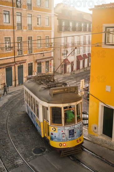 Old tram on the cobbled street in Lisbon, Portugal