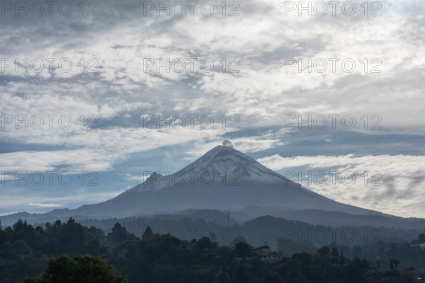 Popocatepetl volcano seen in the morning from a town in the state of Mexico, sunrise in the province.