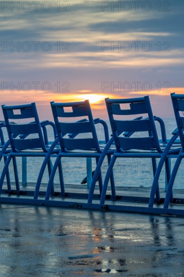 Picturesque blues chairs on the Promenade des Anglais in Nice on the French Riviera