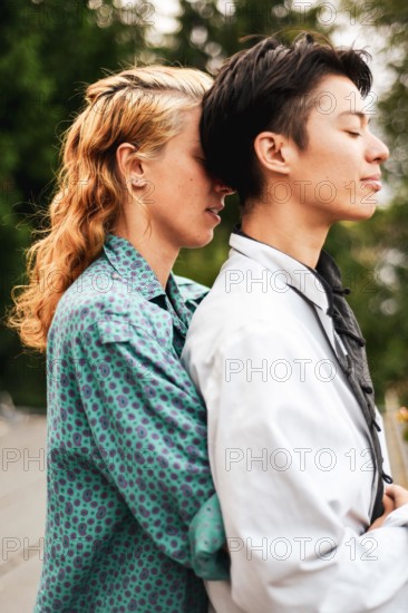 portrait of queer couple having calm quiet moment outdoors together