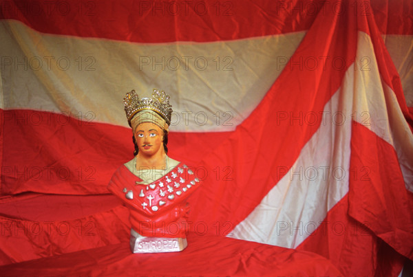 Europe France. St Tropez, South of Les Bravades Bravade annual festival of Patron Saint of town Saint Tropez Effigy small statue in shop window.