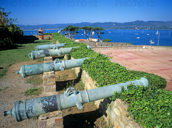 Cannons on old battlements above St Tropez harbour Mediterranean France