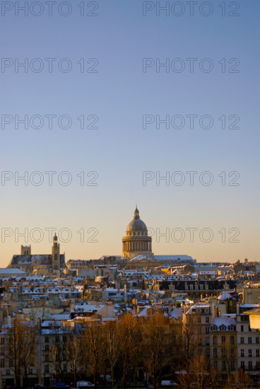 The Pantheon in Paris with morning lights under snow.