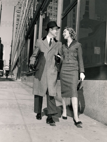Couple walking on city street