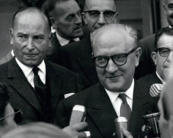 Sep. 09, 1951 - General Secretary of French Section of the Workers' International (SFIO) Guy Mollet is pictured being interviewed by journalists. Mr. Leenhart, who is on the left, is President of the group in Parliament General de Gaulle received them at the Elysee Palac