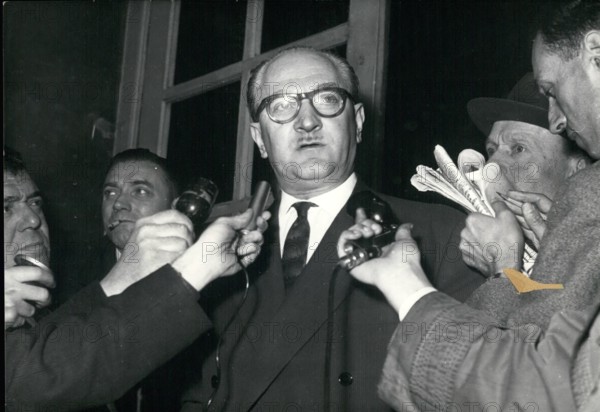 May 05, 1958 - Guy Mollet, who talked with Pierre Pflimlin, announced that he will accept the position of Council Vice-President. He is pictured making his announcement to the press. Germany - Policeman Being Bandaged.