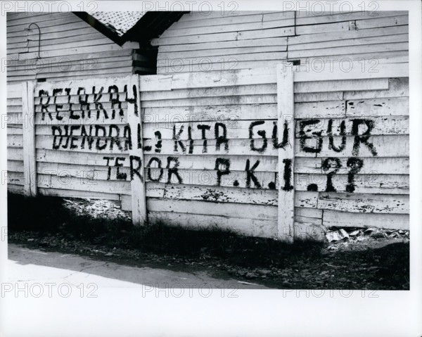 Oct. 10, 1965 - Indonesia: Djakarta - fence in city after aborted communist coup of Oct. 1, 1965, says that communist party is traitor to the Indonesian revolution and charges terror tactics. These signs were seen throughout countryside after the coup.