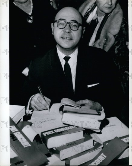 Nov. 11, 1965 - Jacques Borel: Winner of the Goncourt Literary Prize for his book ''Adoration'' -signing his book. (He is English teacher in a Paris school)