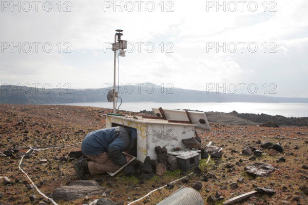 Nea Kameni Island. 14th February, 2015. in Santorini Greece, Costas Papazachos seismologist and professor at the Aristotle University of Thessaloniki and George Vougioukalakis, Dr. Volcanologist geothermal researcher, went to the island of Nea Kameni to check the monitoring equipment that make gas measurements such as carbon dioxide and hydrogen sulfide and repair some damages that hapend due to bad weather conditions. Credit: Konstantina Sidiropoulou/Alamy Live News