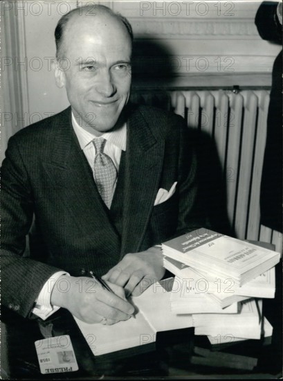 Feb. 24, 1962 - Goncourt Prize Awarded To Belgium Author: Prize Goncourt, the most prize literary award of the year goes to the Belgium Novelist Francis Walder for his book, ''St. Germain Ou La Negotiation'' today. Francis Walder is an officer in the Belgium Army. Photo Shows: The prize winner signing his book. © Keystone Pictures USA/ZUMAPRESS.com/Alamy Live News