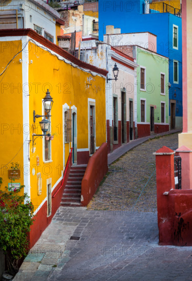 Typical colorful street in Guanajuato, Mexico with its Spanish colonial buildings. ------ Guanajuato is a city and municipality in central Mexico and