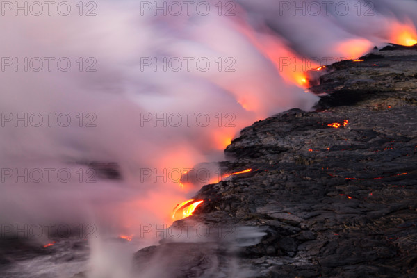 HI00341-00...HAWAI'I - Lava flowing into the Pacific Ocean from the East Riff Zoneof the Kilauea Volcano on the Island of Hawai'i.