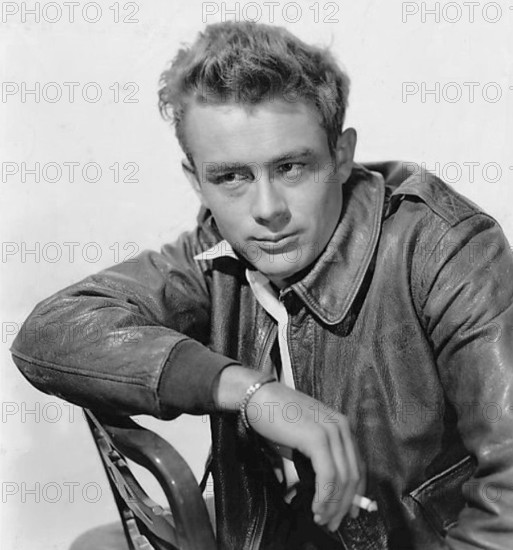 This iconic photograph from 1955 captures James Dean, the American actor, known for his role in films such as 'Rebel Without a Cause'. He became a cultural icon and remains a symbol of youthful rebellion and Hollywood stardom.